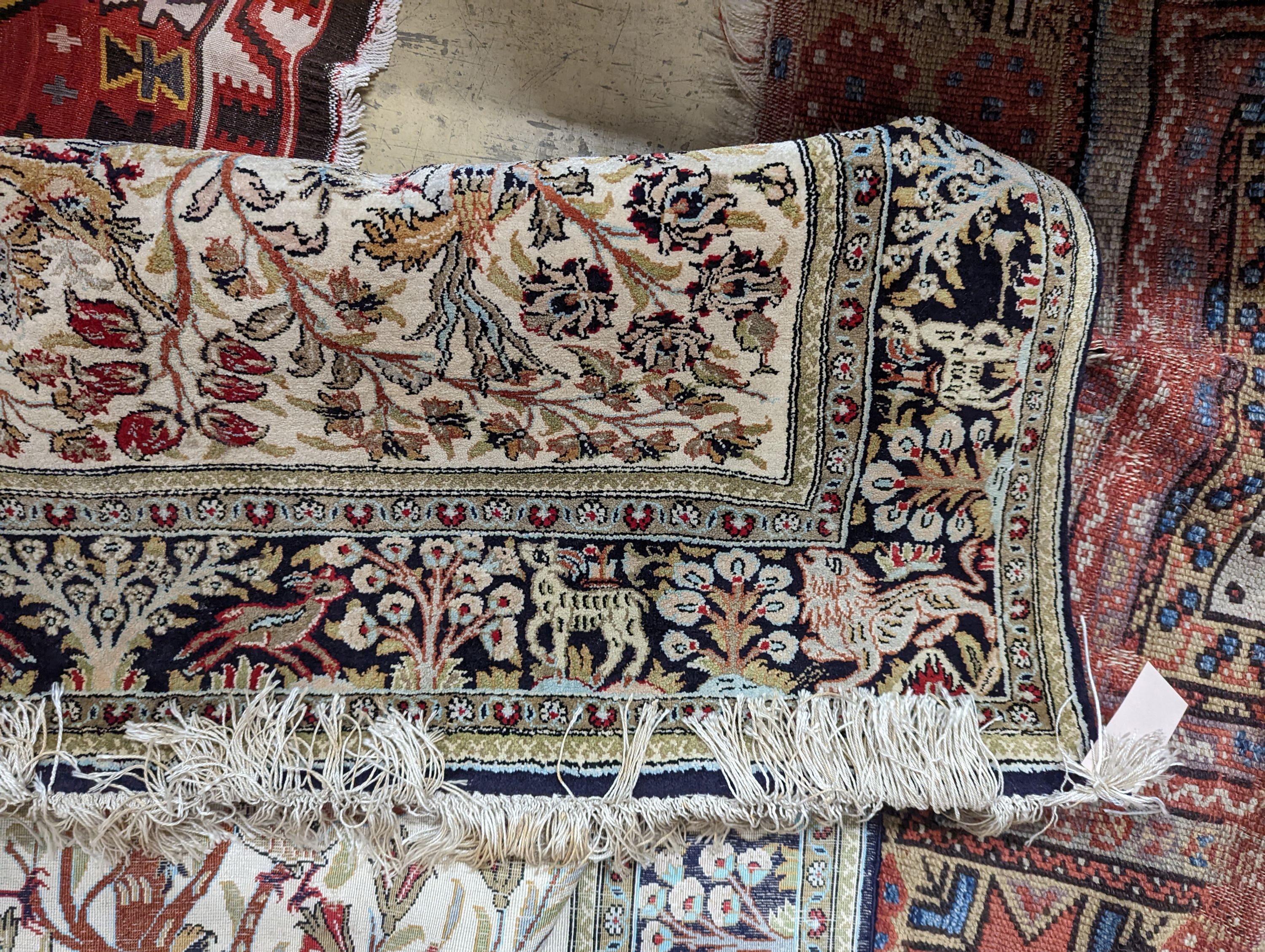 An Ispahan part silk tree of life ivory ground rug, 106 x 150cm
